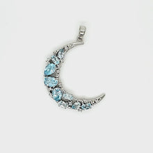 Load and play video in Gallery viewer, Crescent Pendant in Blue Topaz
